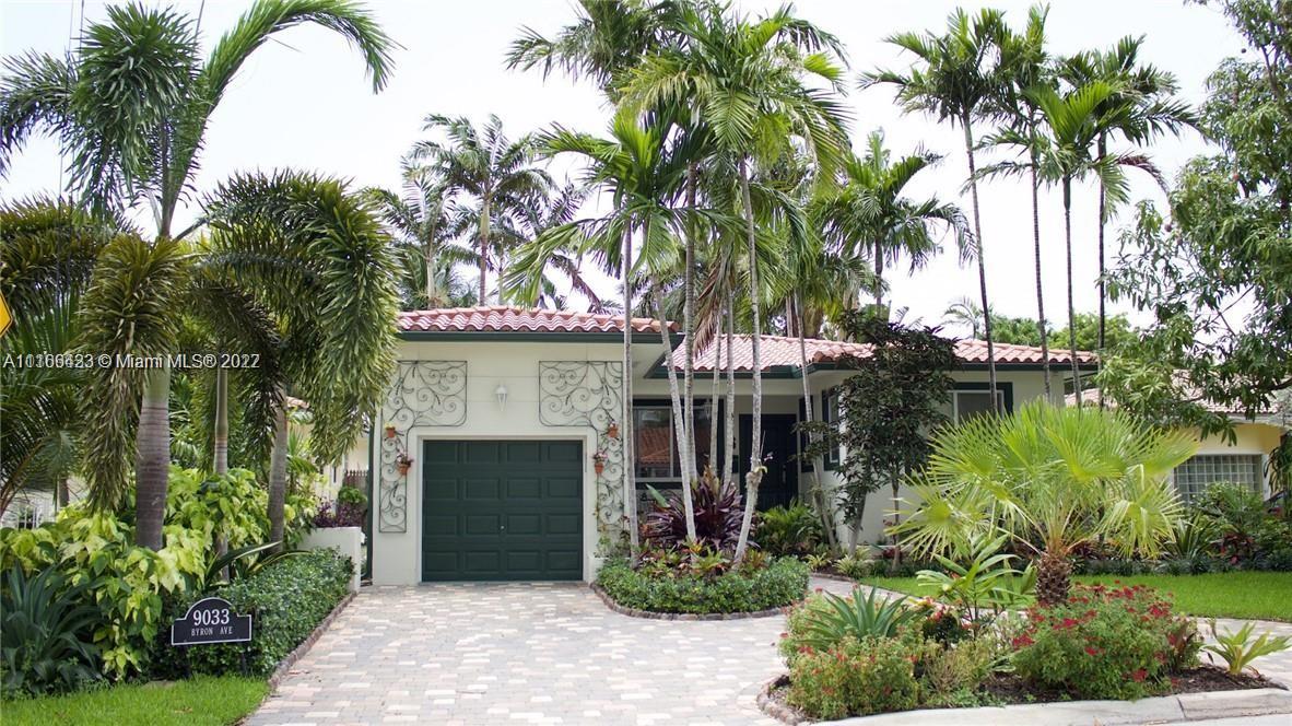 9033 Byron Avenue Surfside, FL 33154 - Photo 1 of 25 a front view of a house with garden