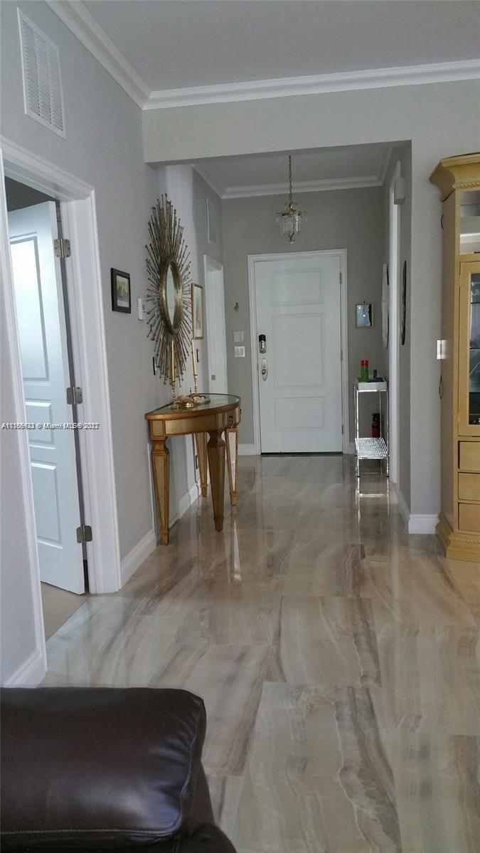 9033 Byron Avenue Surfside, FL 33154 - Photo 14 of 25 a view of a hallway with seating area
