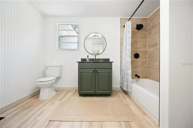 a bathroom with a toilet a sink and a bathtub