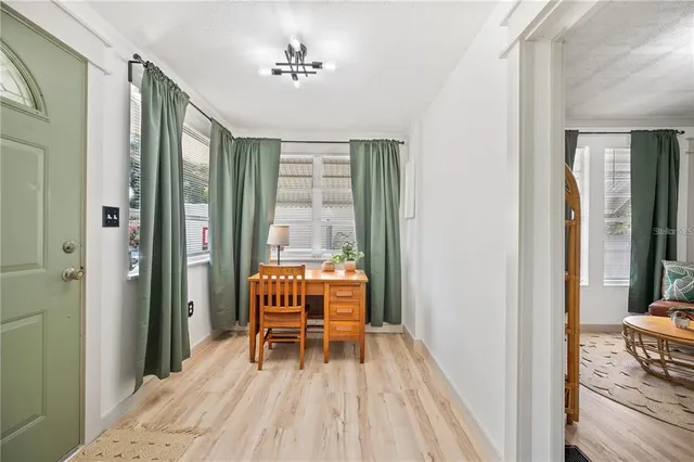 a view of room with furniture and wooden floor