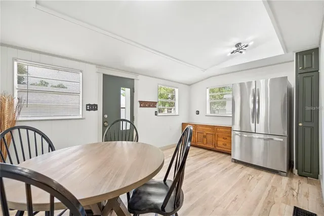 a dining room with furniture and window