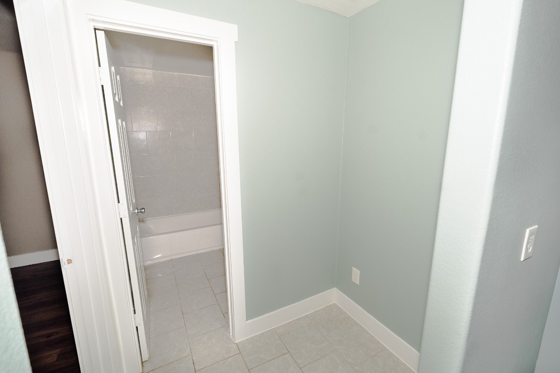 4826 Bristol Street Houston, TX 77009 - Photo 11 of 25 a bathroom with a glass door