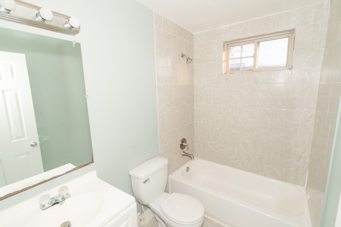 4826 Bristol Street Houston, TX 77009 - Photo 13 of 25 a bathroom with a sink a toilet and bathtub