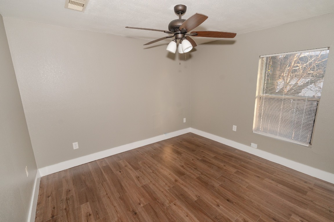 4826 Bristol Street Houston, TX 77009 - Photo 16 of 25 wooden floor in an empty room with a window