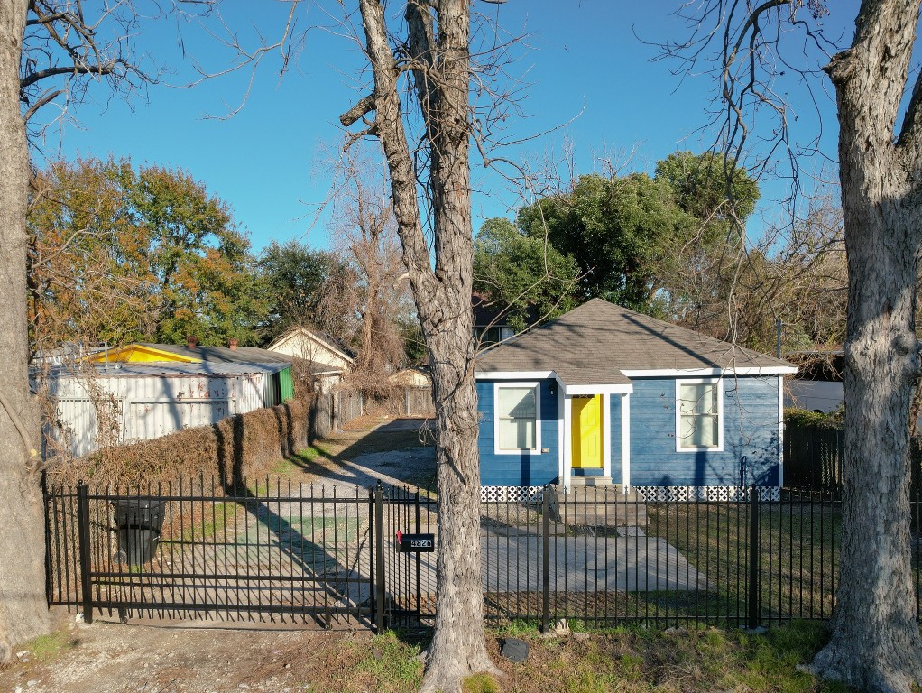 4826 Bristol Street Houston, TX 77009 - Photo 2 of 25 a front view of a house with iron fence