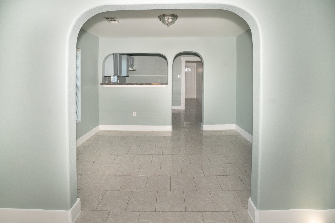 4826 Bristol Street Houston, TX 77009 - Photo 6 of 25 a view of a livingroom with wooden floor and a window
