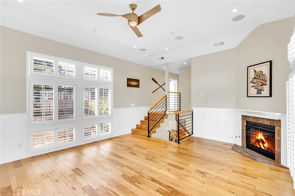 34061 Formosa Dana Point, CA 92629 - Photo 18 of 61 a view of a livingroom with wooden floor a ceiling fan and windows