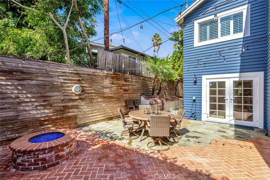 34061 Formosa Dana Point, CA 92629 - Photo 43 of 61 a view of a patio with table and chairs and wooden fence