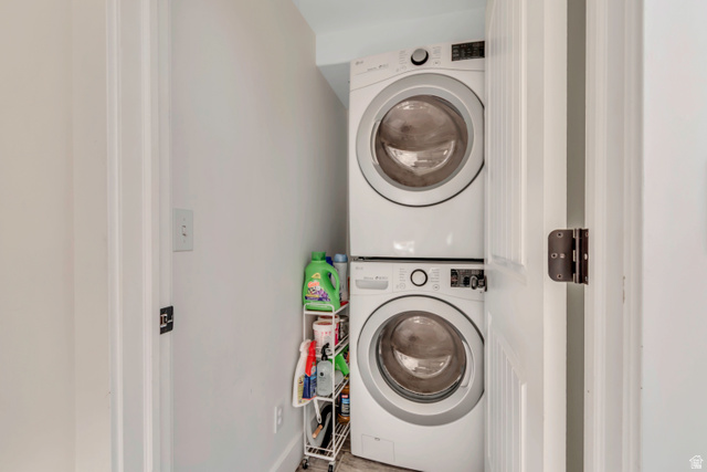 1071 Jamie-Matt Circle Layton, UT 84041 - Photo 12 of 28 Laundry area with stacked washer and clothes dryer and baseboards