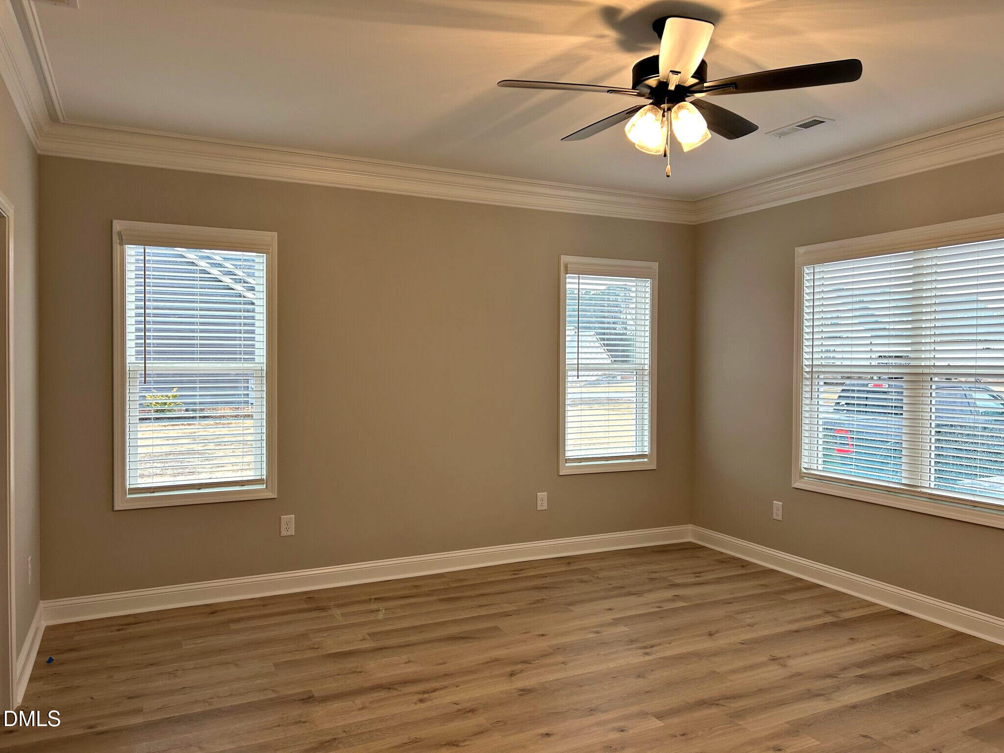 113 Prency Lane Middlesex, NC 27557 - Photo 8 of 18 a view of an empty room with a window and wooden floor