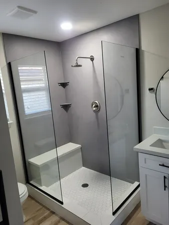 a bathroom with a shower and toilet