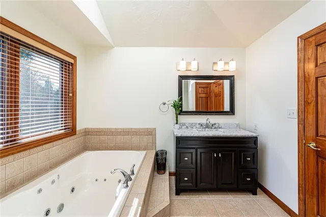 a bathroom with a bathtub and a sink