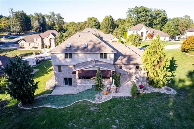 an aerial view of a house with a garden and plants