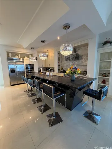 a living room with lots of furniture and a rug