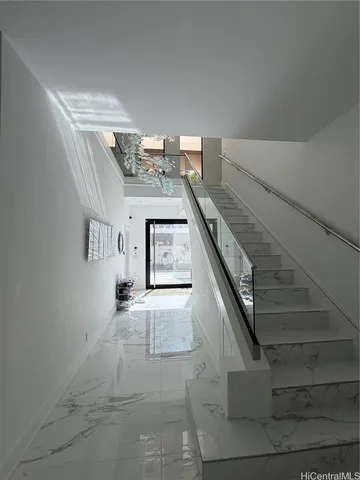 a view of entryway and kitchen