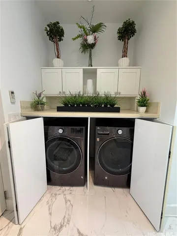 a view of a sink and cabinets