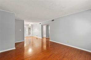 1822 North Rock Springs Road Northeast, Unit 7 Atlanta, GA 30324 - Photo 5 of 21 a view of an empty room with wooden floor