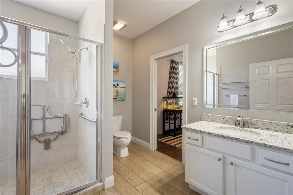 2002 Water Key Drive Windermere, FL 34786 - Photo 25 of 60 a bathroom with a granite countertop sink toilet and shower