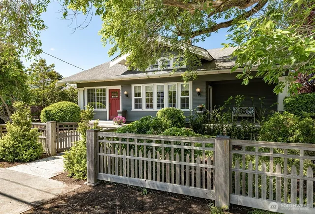 a front view of house with a garden