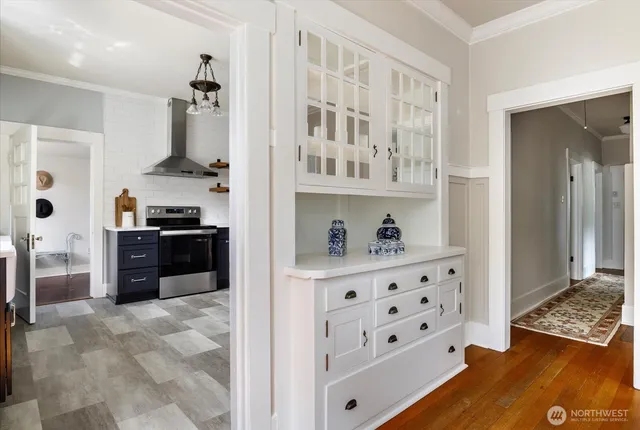 a kitchen with stainless steel appliances a refrigerator and a stove top oven