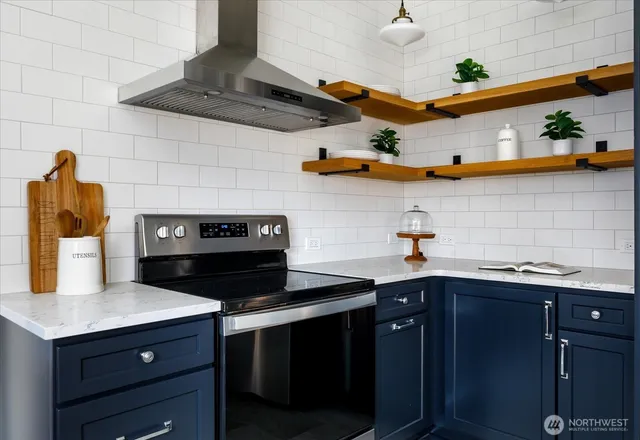 a kitchen with a sink a stove and cabinets