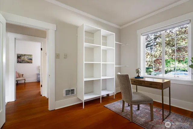 a workspace with furniture and a window