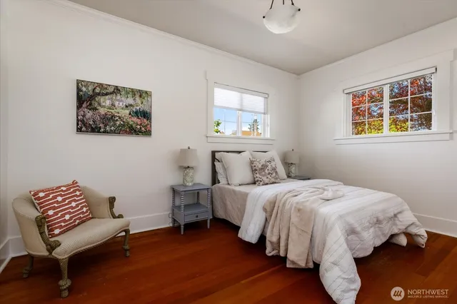 a bed room with a bed and a chair