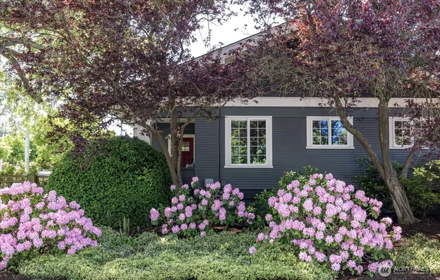 a front view of a house with tree s
