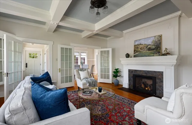 a living room with furniture a window and a fireplace