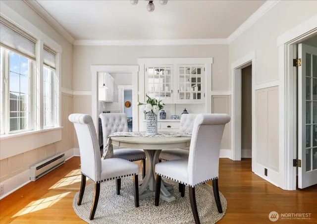 a view of a dining room with furniture window and wooden floor