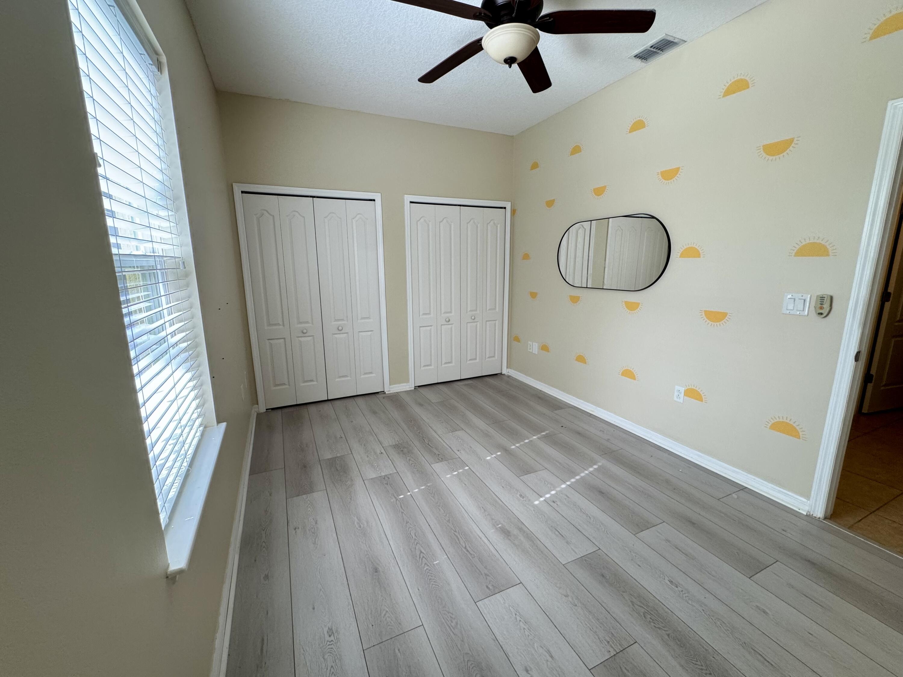 520 Southwest Dailey Avenue Port St. Lucie, FL 34953 - Photo 14 of 34 a view of empty room with wooden floor