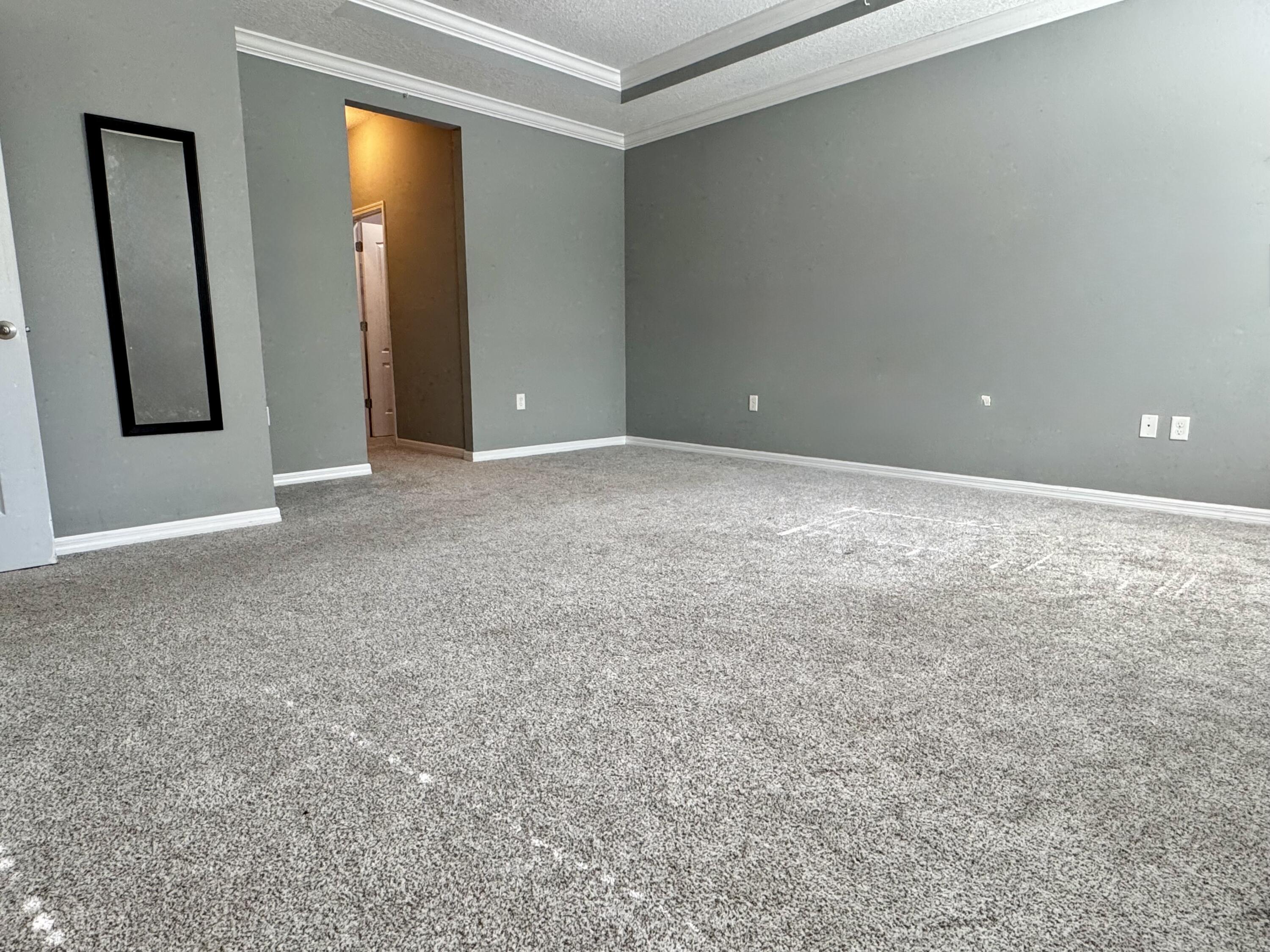 520 Southwest Dailey Avenue Port St. Lucie, FL 34953 - Photo 17 of 34 an empty room with closet and mirror