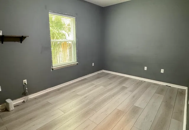 wooden floor and window in a room