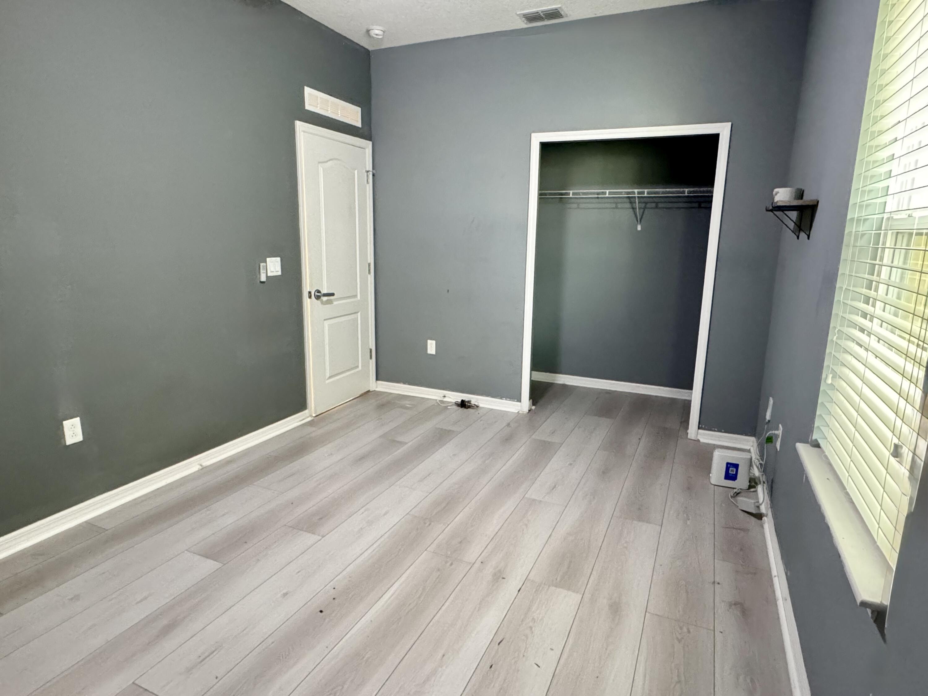 520 Southwest Dailey Avenue Port St. Lucie, FL 34953 - Photo 24 of 34 wooden floor and window in a room