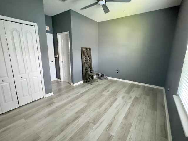a view of a bathroom with a tub and shower