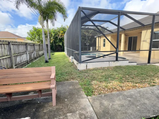 a view of backyard with small cabin