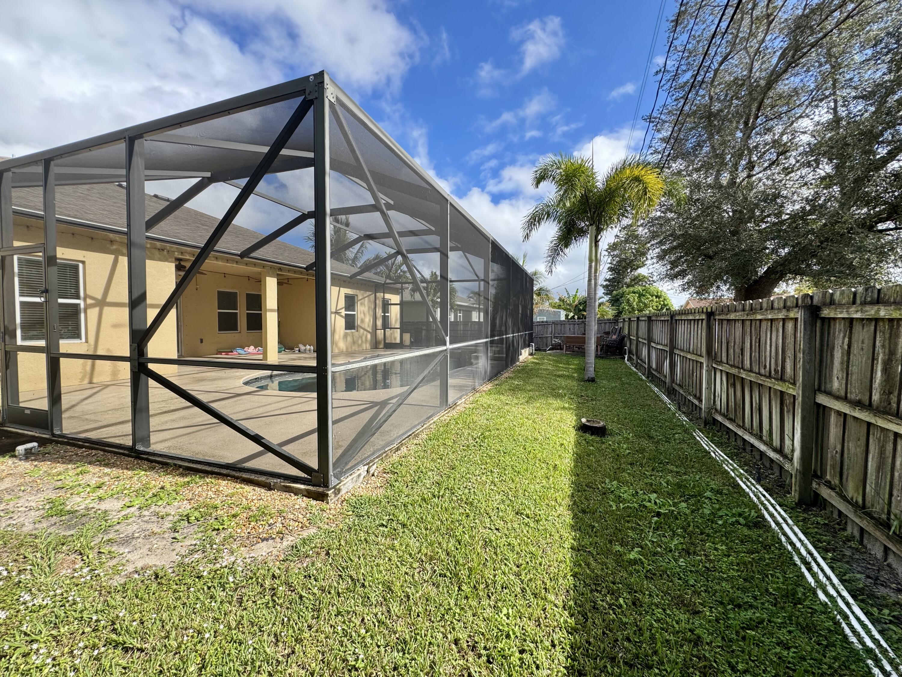 520 Southwest Dailey Avenue Port St. Lucie, FL 34953 - Photo 31 of 34 a view of backyard with small cabin