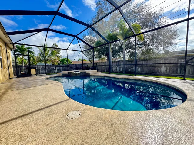 a view of a swimming pool with a porch
