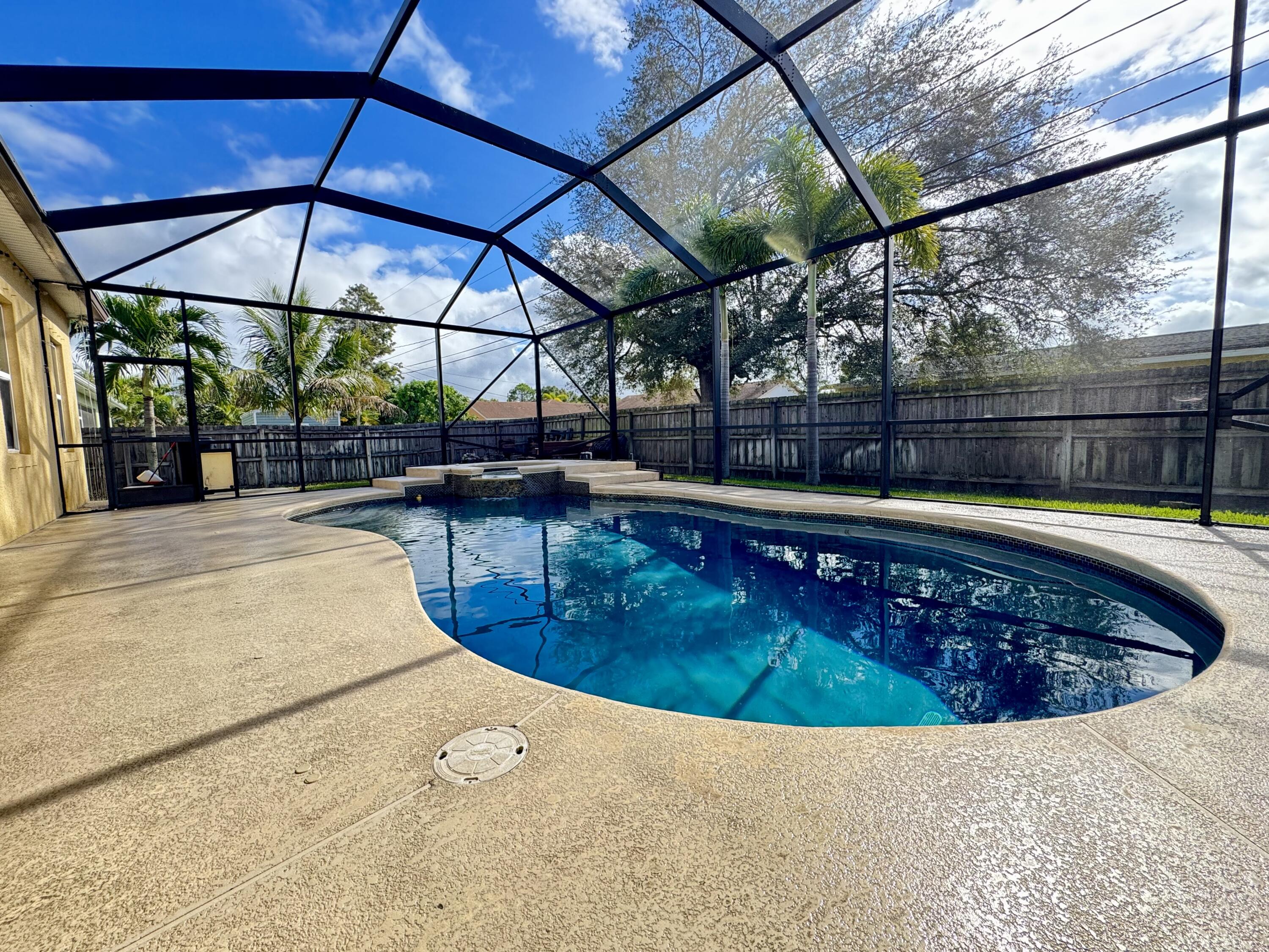 520 Southwest Dailey Avenue Port St. Lucie, FL 34953 - Photo 32 of 34 a view of a swimming pool with a patio