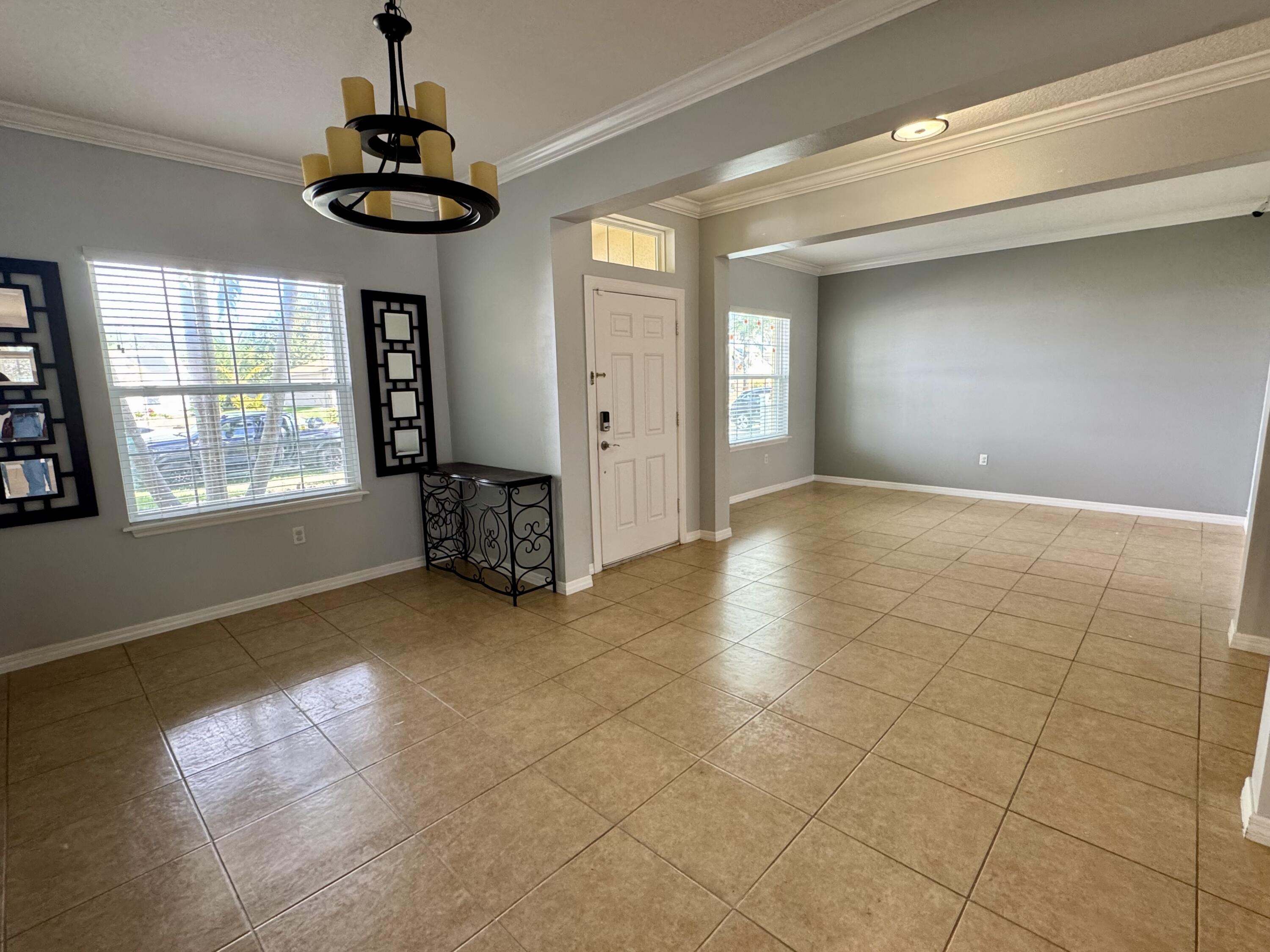 520 Southwest Dailey Avenue Port St. Lucie, FL 34953 - Photo 10 of 34 a view of an empty room with a window