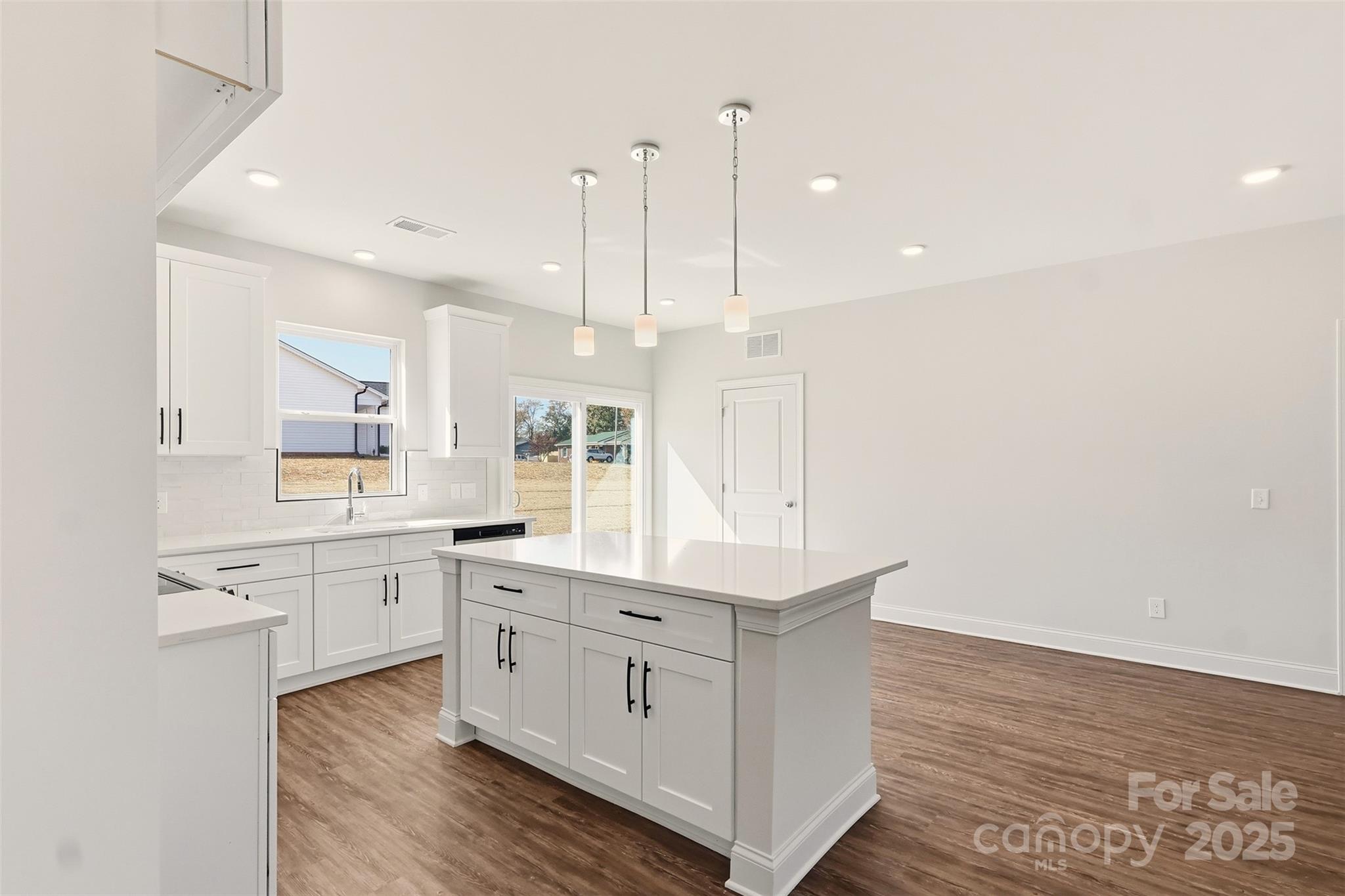 126 North Main Street Granite Falls, NC 28630 - Photo 11 of 34 a large white kitchen with a large window