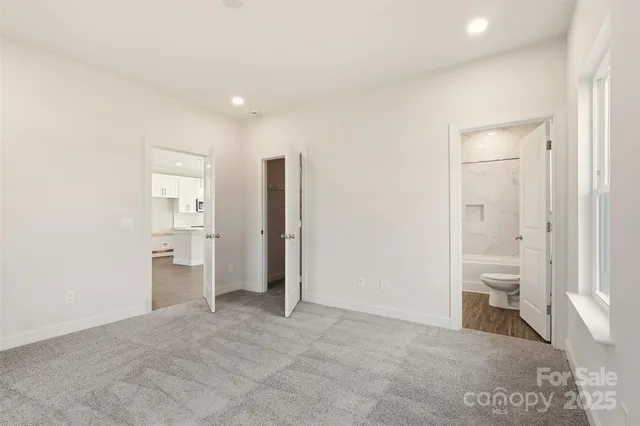 a view of a room with a bathroom and a toilet