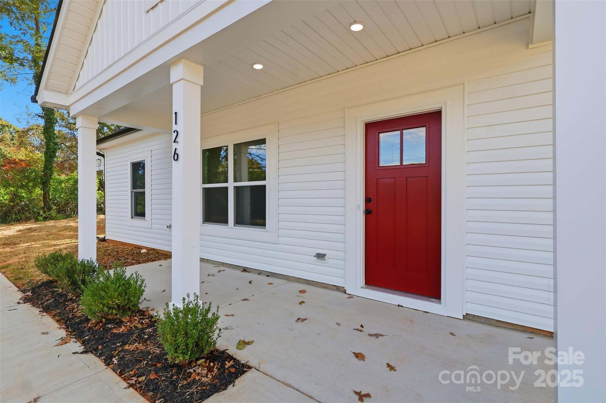 126 North Main Street Granite Falls, NC 28630 - Photo 2 of 34 a front view of a house with plants