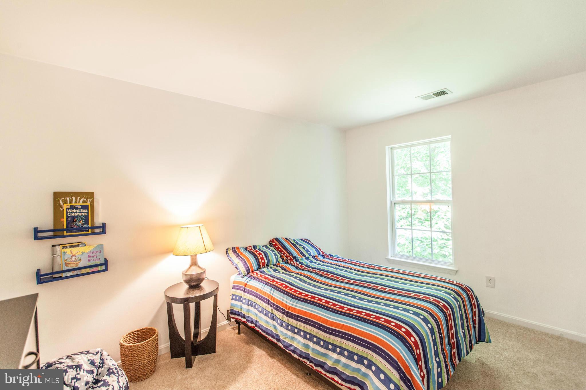 3024 Old Channel Road Laurel, MD 20724 - Photo 13 of 17 a bedroom with a bed and chair