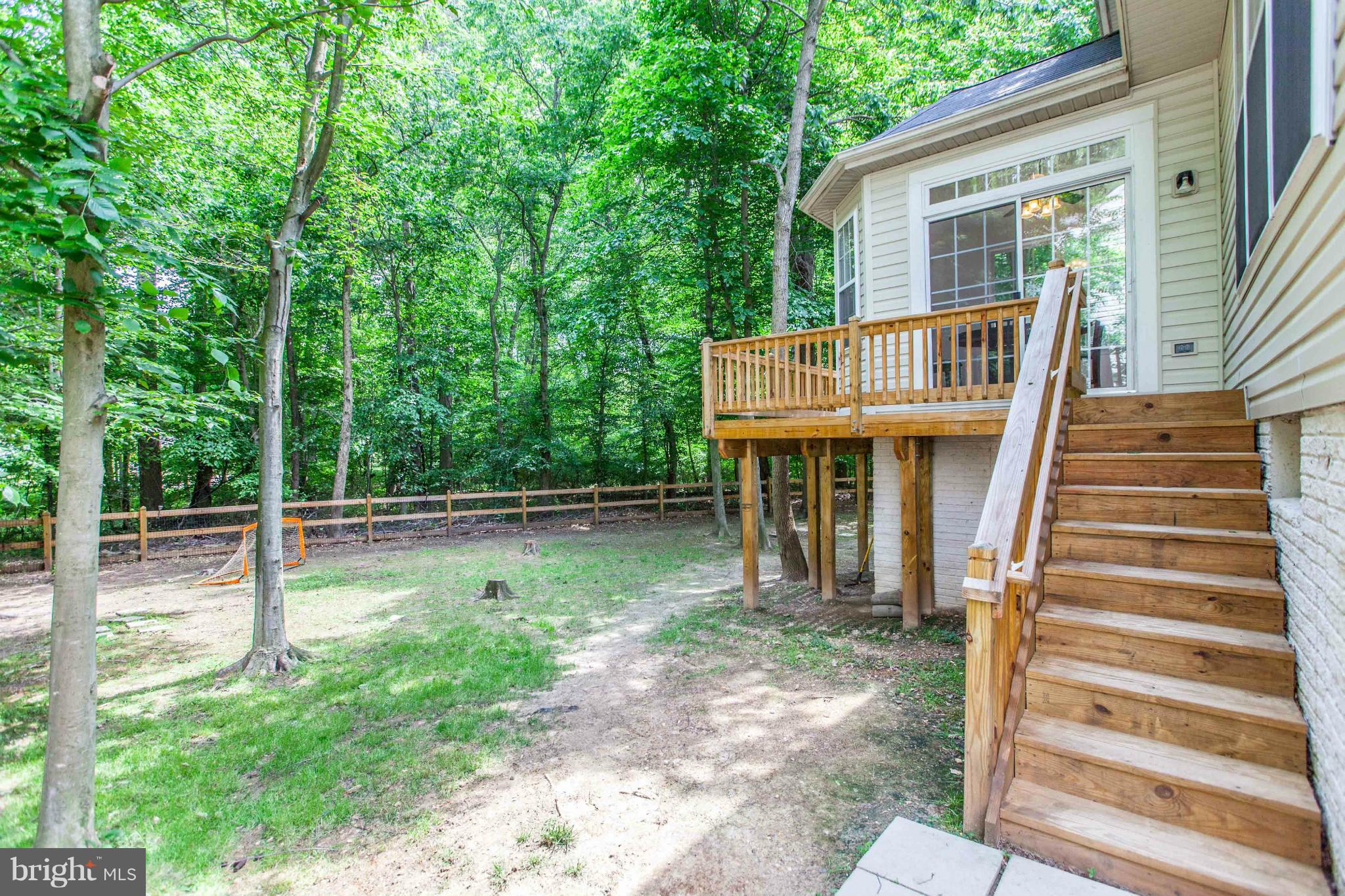 3024 Old Channel Road Laurel, MD 20724 - Photo 16 of 17 a backyard of a house with lots of green space