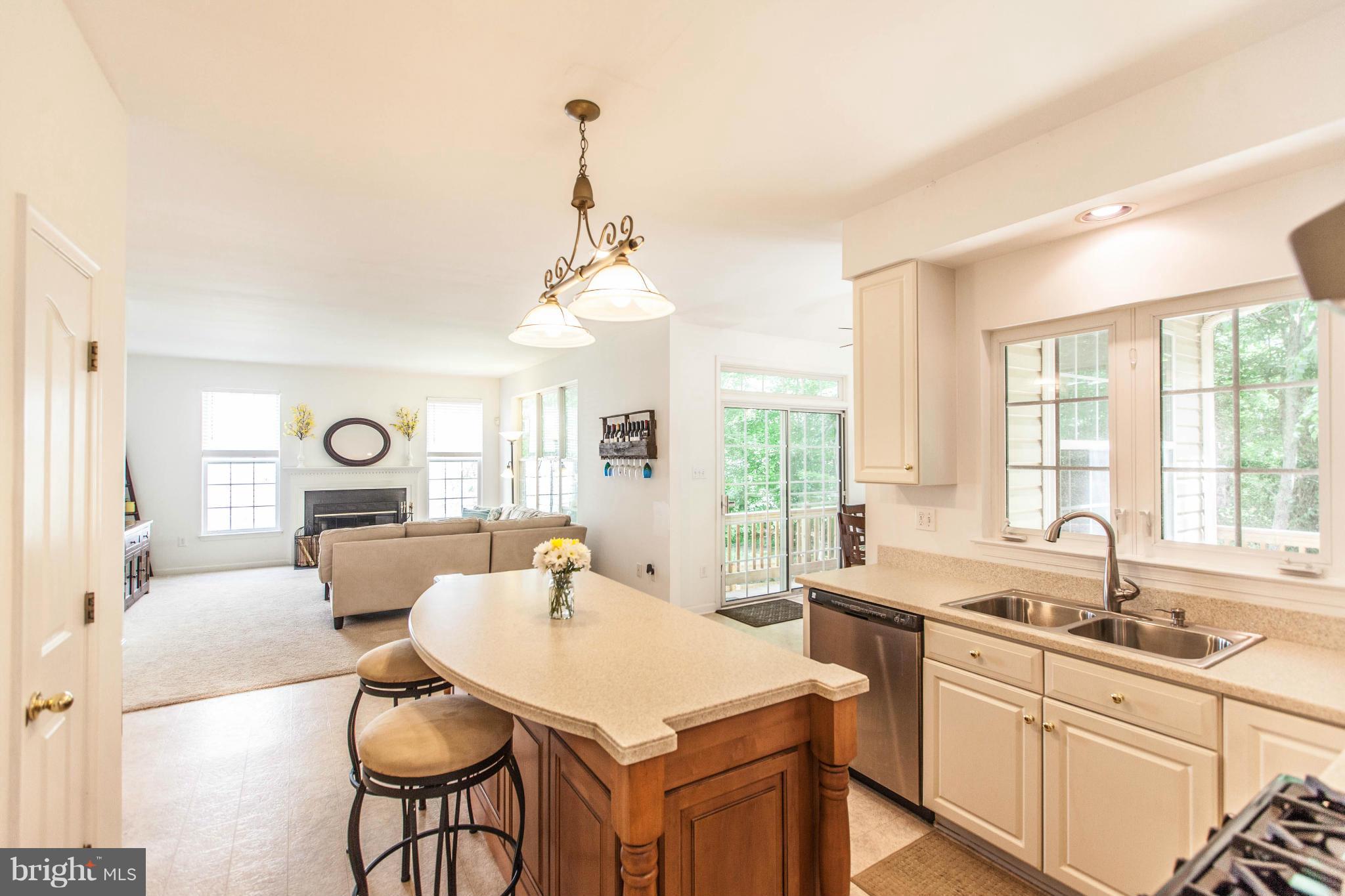 3024 Old Channel Road Laurel, MD 20724 - Photo 3 of 17 a large kitchen with a table chairs and a large window
