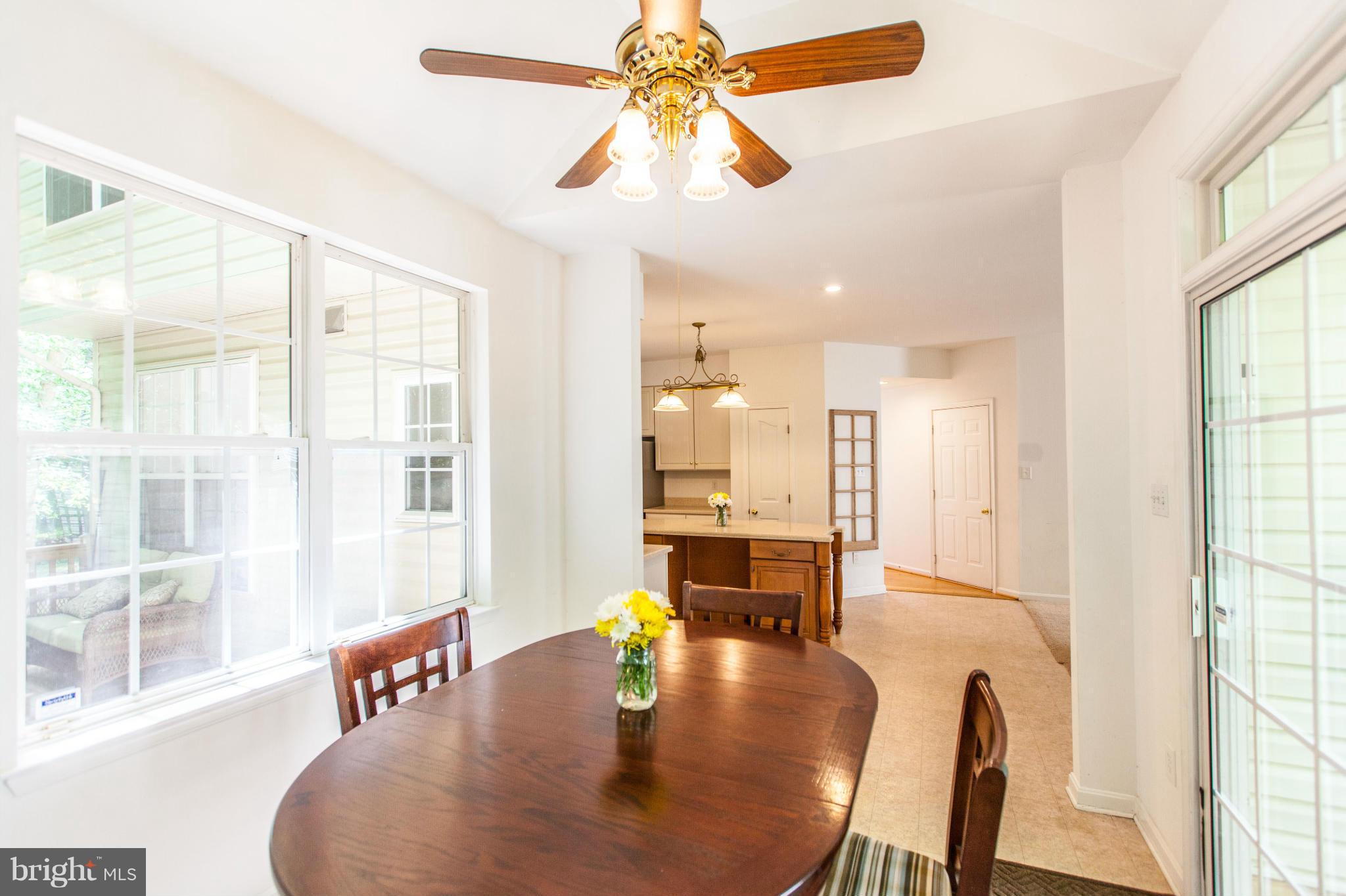 3024 Old Channel Road Laurel, MD 20724 - Photo 4 of 17 a dining room with furniture a chandelier and wooden floor