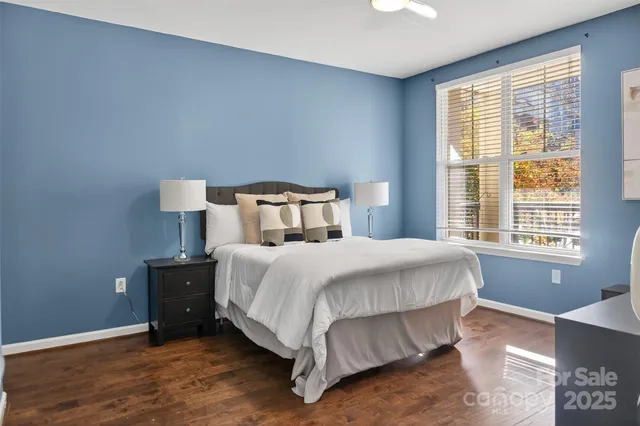 a bedroom with a bed and window