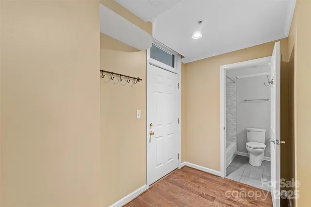a bathroom with a toilet and a shower