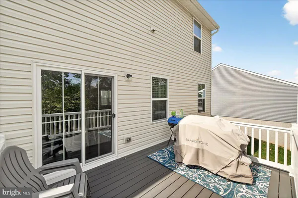 a view of a two chairs in the balcony